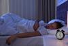 Person asleep in bed looking peaceful