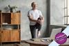 Man doing yoga in his living room
