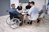 Team meeting taking places with people of different races and abilities