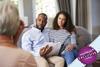 Couple sat on sofa talking to therapist