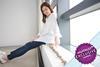 Woman sat on windowsill counting change