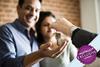 Couple receiving house keys to new property
