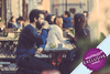 Man and woman drinking coffee in street cafe