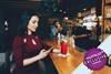 Woman alone at bar texting