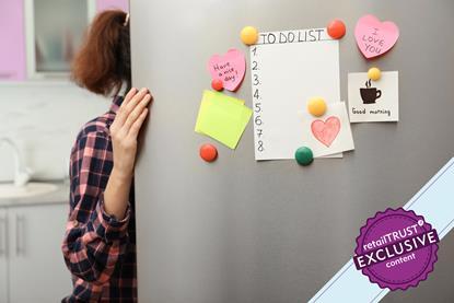 Woman looking in fridge