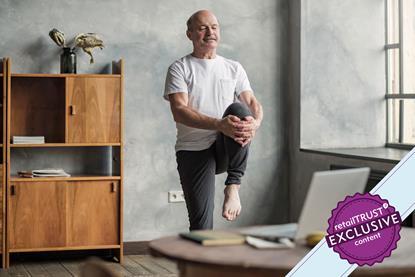 Man doing yoga in his living room