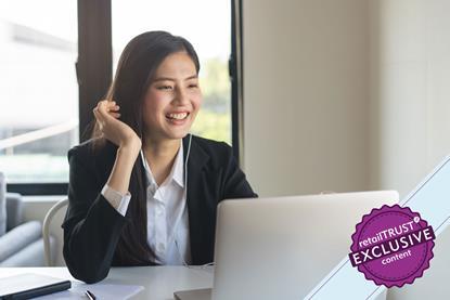 smartly dressed woman talking online