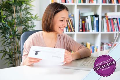 Woman studying her CV at a laptop