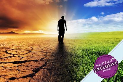 Man walking towards a beautiful sunset along a straight path with barren land on his left and lush land on his right