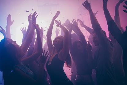 Young people dancing in a club