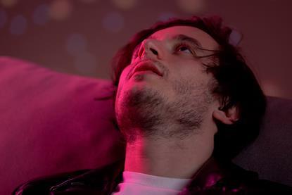 Man staring vacantly at the ceiling
