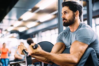 Man lifting weights in a gym