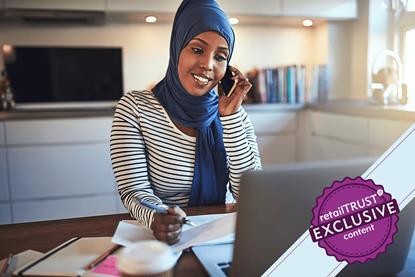 Woman speaking on the phone making notes