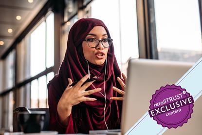 Woman in hijab partaking in an online meeting