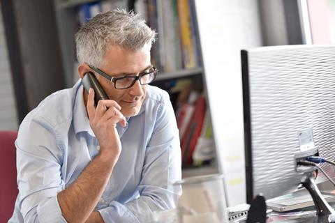 Mature man speaking on the phone