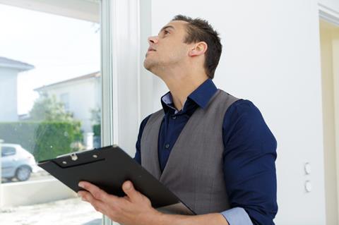 Man undertaking a home inspection